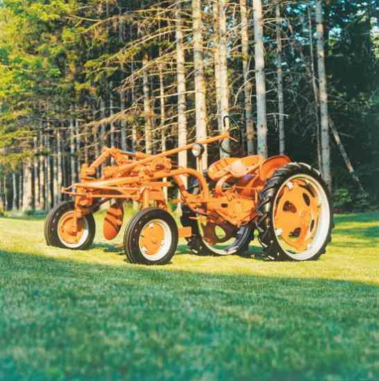 The 1948 Allis Chalmers G. This nifty little tractor is equipped with a 12-inch one-bottom plow, a hydraulic lift, a self-starter, and a headlight.